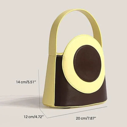 Chic color block vegan leather bucket bag with adjustable strap, perfect for everyday use and special occasions