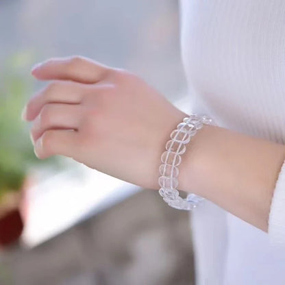 Natural white crystal single loop bracelet with a geometric pattern, providing radiation protection and elegant style