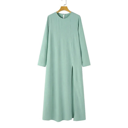 Elegant polyester dress with long sleeves, high slit hem, and available in caramel, black, blue, green, and pink colors