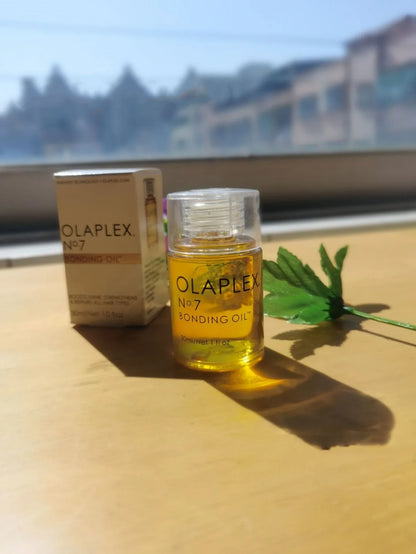 Bottle of Hair Smoothing and Anti-Heat Repair Oil for nourishing and protecting damaged hair