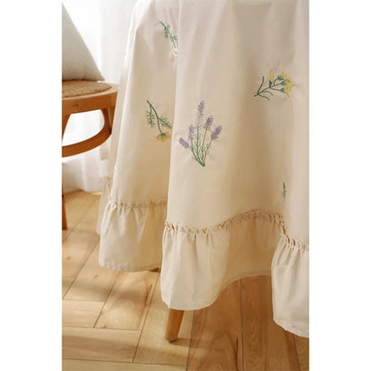 Elegant cotton tablecloth with apricot embroidery and lotus leaf edge, perfect for dining decor