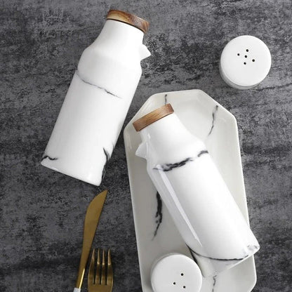 Elegant ceramic salt and pepper oil bottle set with wooden lids, perfect for storing and displaying seasonings and cooking oils in a modern kitchen