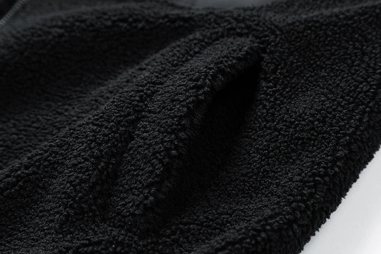 A cozy and stylish men's fleece jacket with a standing collar and convenient side pockets, available in a range of classic colors.