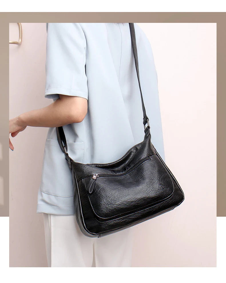 Stylish one-shoulder messenger bag in various colors with a soft, supple PU leather exterior and a spacious, organized main compartment