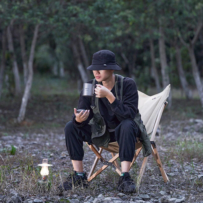 Durable outdoor folding chair with solid beech wood frame and breathable cotton canvas seating for comfortable camping and outdoor adventures