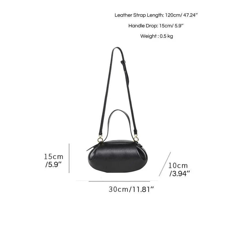 Circular vegan leather handbag in a tan color, with a sturdy build and thoughtful interior design for versatile use.