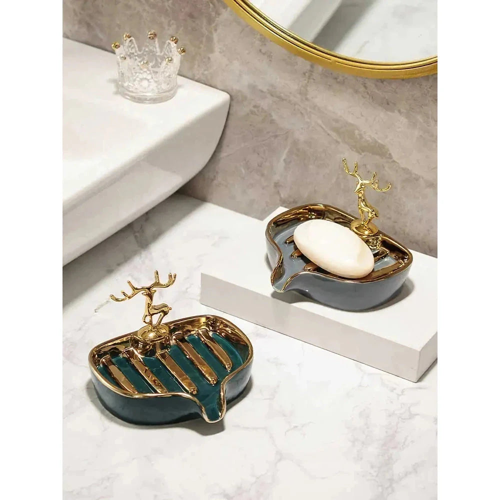 A white gold ceramic soap dish with a drainage design, showcasing a sleek and elegant bathroom accessory.