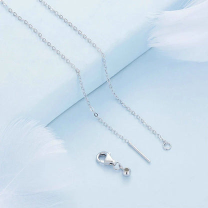 Elegant platinum-plated adjustable green pendant necklace with a sleek, silver-toned chain and a stylish green pendant