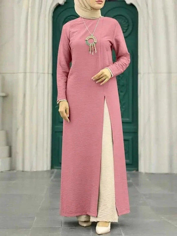 Elegant polyester dress with long sleeves, high slit hem, and available in caramel, black, blue, green, and pink colors