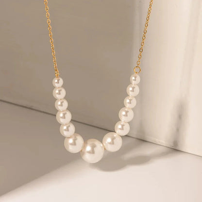 Elegant pearl and gold-plated stainless steel necklace/bracelet with lustrous pearls and vintage-inspired design