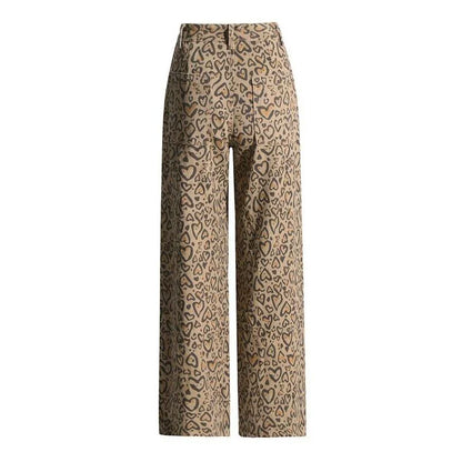 Chic high-waisted patchwork leopard print denim trousers with rivet details and wide-leg silhouette