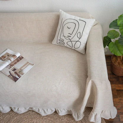 Elegant ruffled sofa cover in a variety of solid colors, offering a timeless American style for any living room