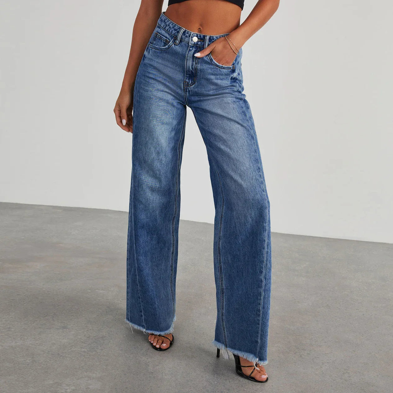 A pair of high-waisted jeans with pockets, designed for a comfortable and stylish fit.