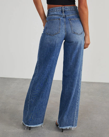 A pair of high-waisted jeans with pockets, designed for a comfortable and stylish fit.