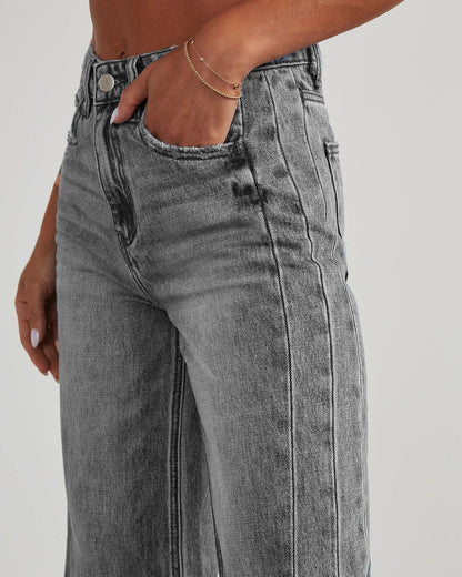 A pair of high-waisted jeans with pockets, designed for a comfortable and stylish fit.