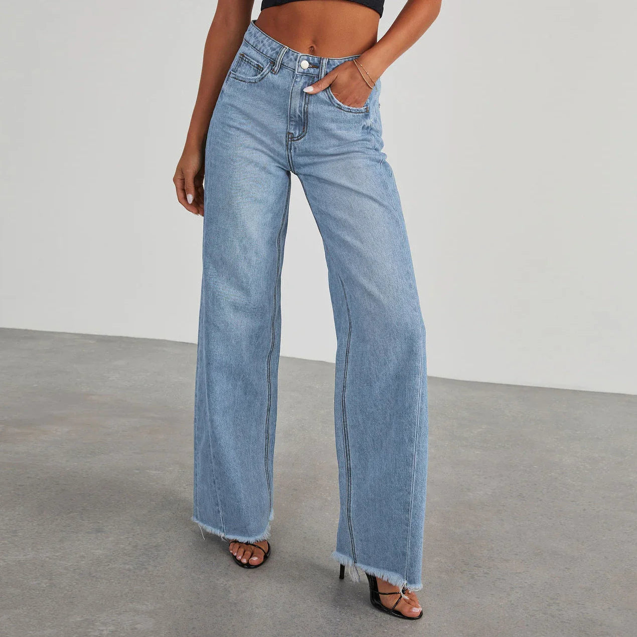 A pair of high-waisted jeans with pockets, designed for a comfortable and stylish fit.