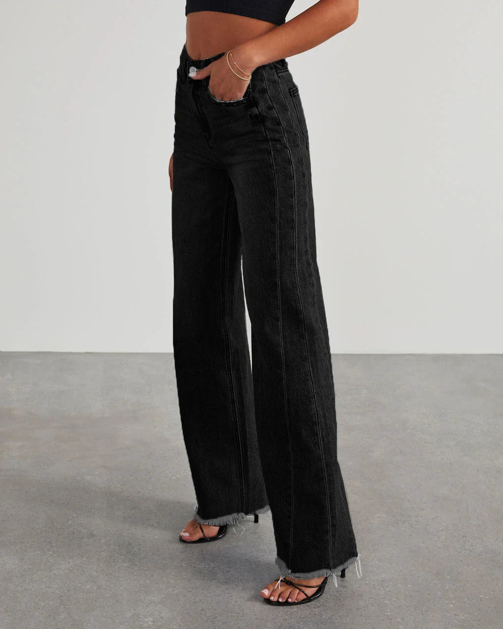 A pair of high-waisted jeans with pockets, designed for a comfortable and stylish fit.