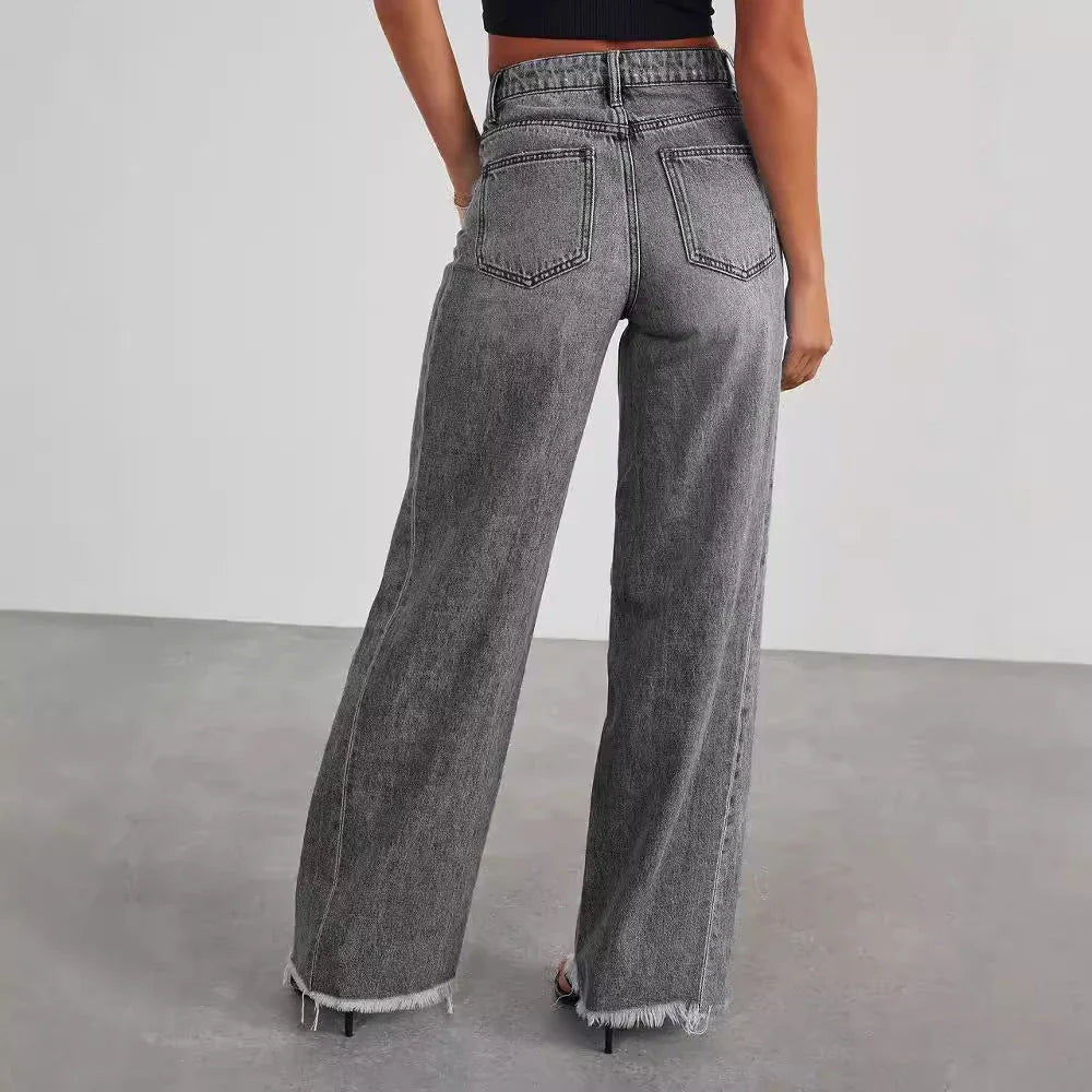 A pair of high-waisted jeans with pockets, designed for a comfortable and stylish fit.