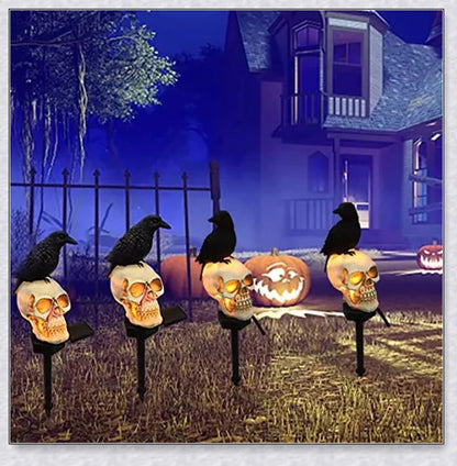 A solar-powered landscape light in the shape of a crow perched on a skull, providing an eerie and captivating outdoor decoration.