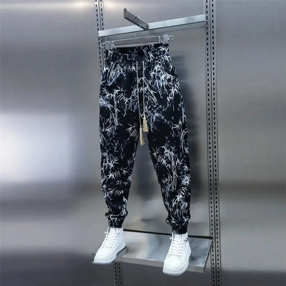 Loose, breathable men's harem pants in a floral print design for comfortable summer style