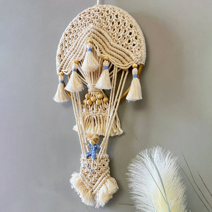 Handcrafted cotton tapestry featuring vibrant hot air balloon design, perfect for wall decor in living room or bedroom.