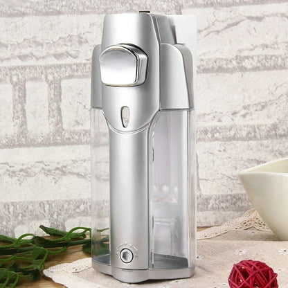 A modern, silver-colored 350ml wall-mounted soap and shampoo dispenser with a sleek, touch-free design for enhanced hygiene in bathrooms and kitchens.