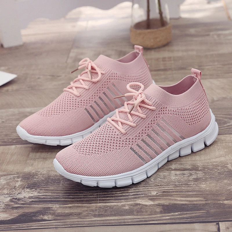 Breathable woven mesh shoes with a stylish cross-strap design and flexible rubber soles for all-day comfort and support.