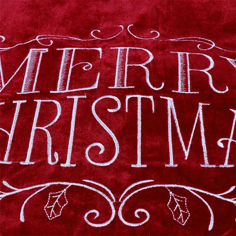A luxurious red velvet cloth Christmas tree skirt with a 48-inch diameter, designed to add elegance and sophistication to your holiday decor.
