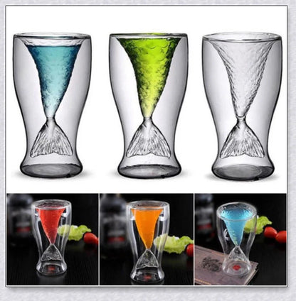 Transparent glass mug with a mermaid tail design, available in blue, green, pink, and yellow colors
