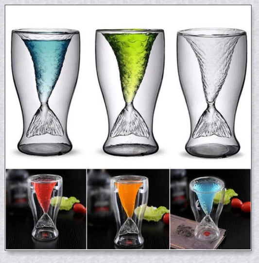 Transparent glass mug with a mermaid tail design, available in blue, green, pink, and yellow colors