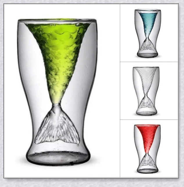 Transparent glass mug with a mermaid tail design, available in blue, green, pink, and yellow colors