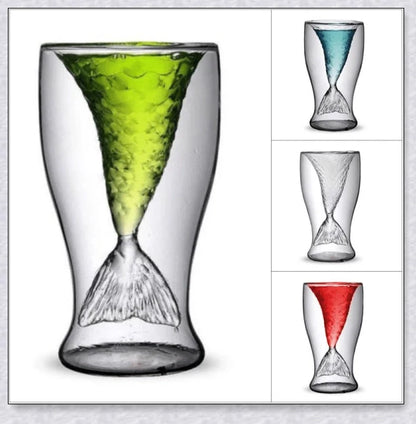 Transparent glass mug with a mermaid tail design, available in blue, green, pink, and yellow colors