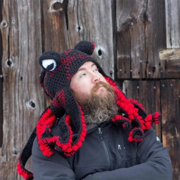 A festive Christmas crochet hat with an octopus design, featuring curly tentacles and big eyes for a whimsical, holiday-inspired look.