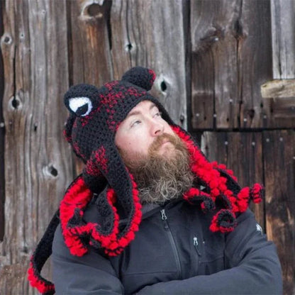 A festive Christmas crochet hat with an octopus design, featuring curly tentacles and big eyes for a whimsical, holiday-inspired look.