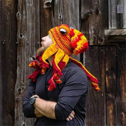 A festive Christmas crochet hat with an octopus design, featuring curly tentacles and big eyes for a whimsical, holiday-inspired look.