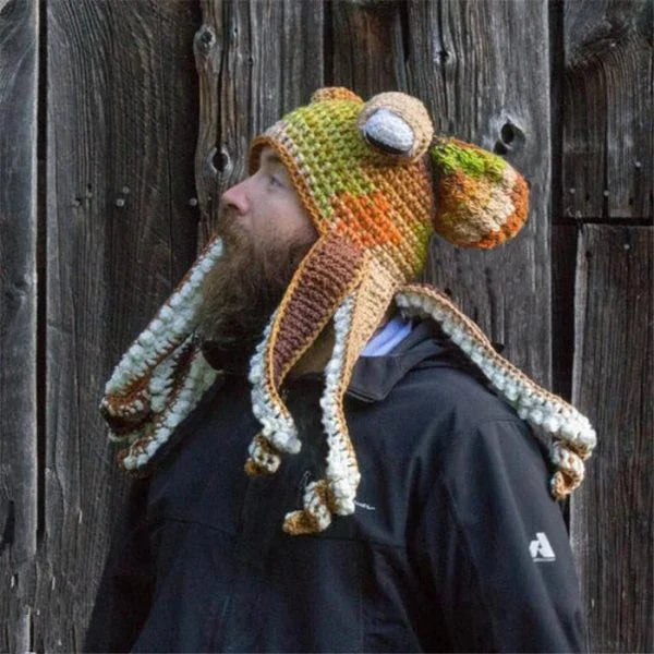 A festive Christmas crochet hat with an octopus design, featuring curly tentacles and big eyes for a whimsical, holiday-inspired look.