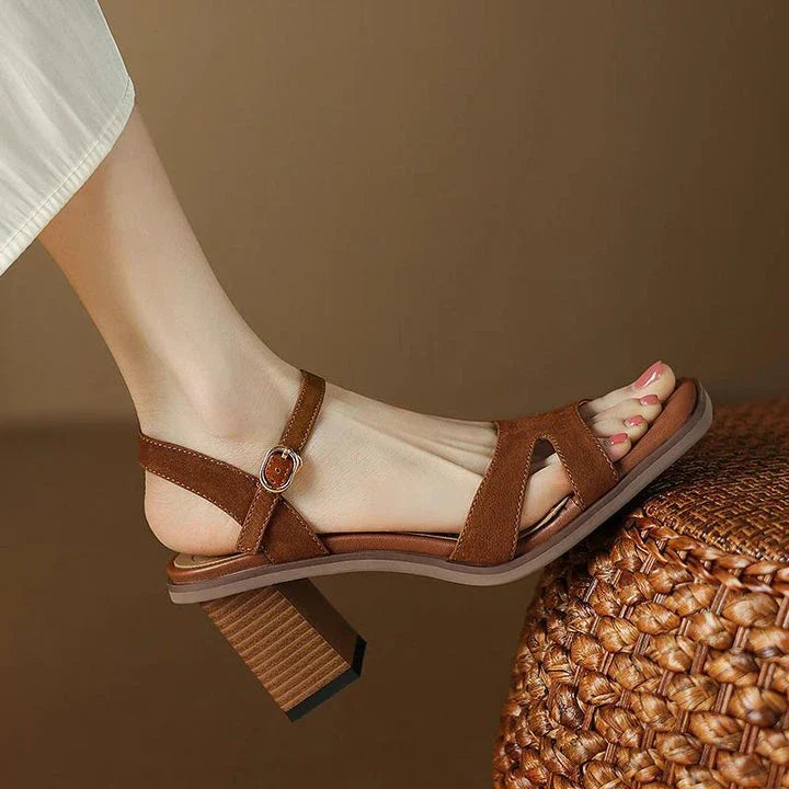 Chic open-toe leather sandals with a chunky 2-inch square heel, offering a stylish and comfortable design for summer fashion