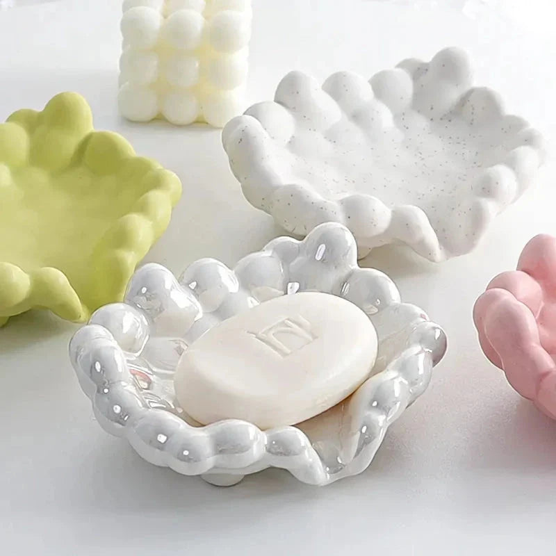 Ceramic soap dish with a whimsical cloud design, perfect for enhancing bathroom decor