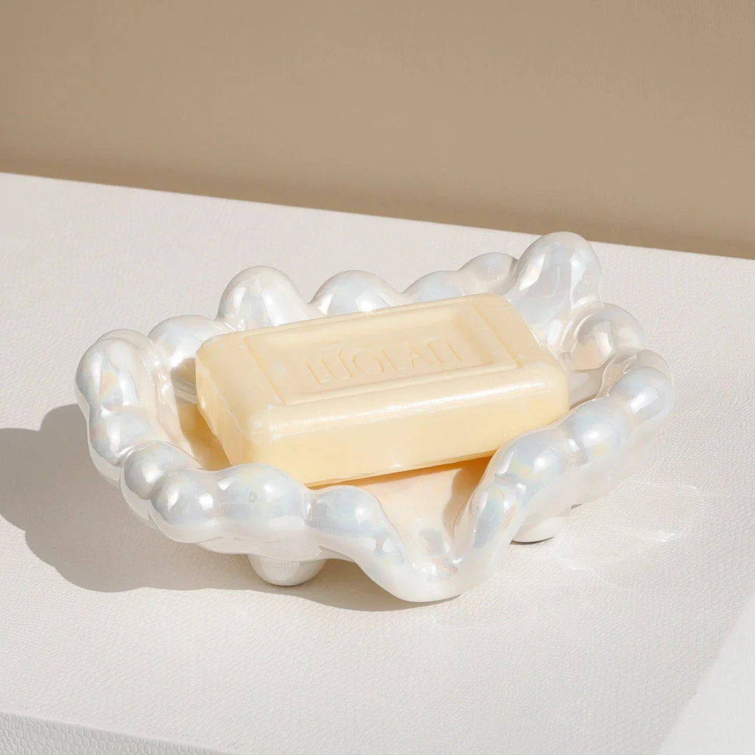 Ceramic soap dish with a whimsical cloud design, perfect for enhancing bathroom decor