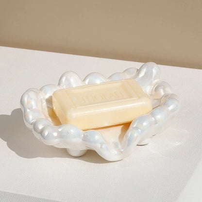 Ceramic soap dish with a whimsical cloud design, perfect for enhancing bathroom decor