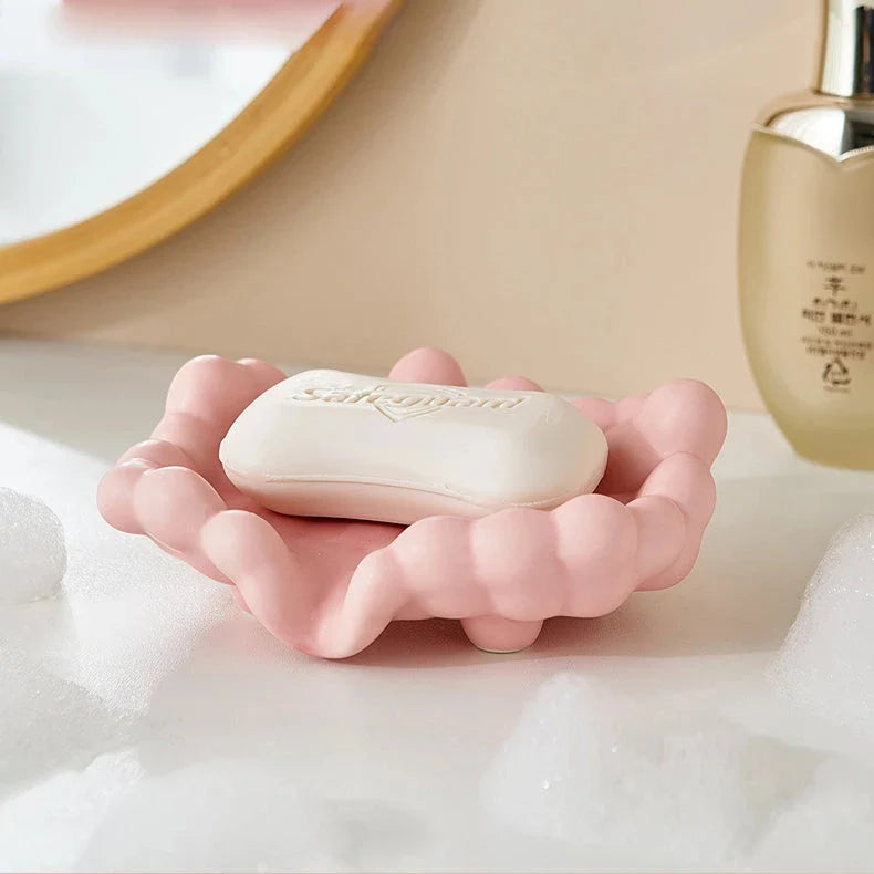 Ceramic soap dish with a whimsical cloud design, perfect for enhancing bathroom decor