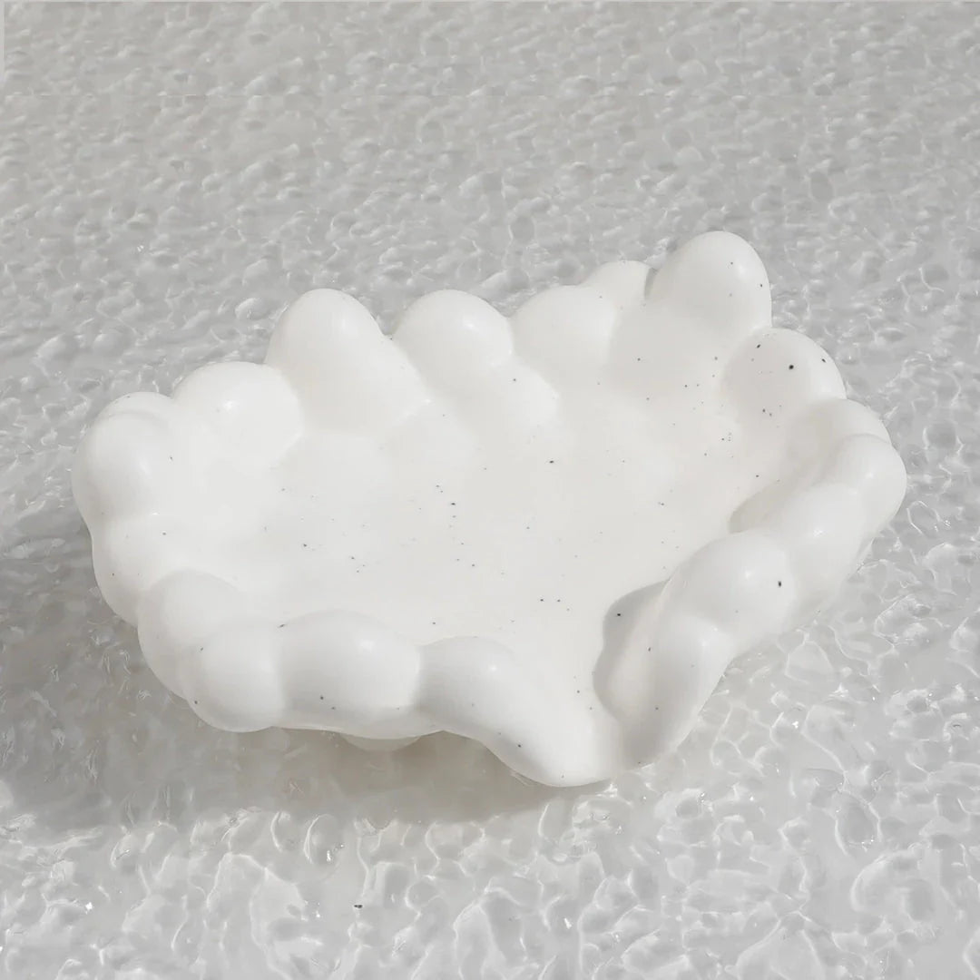 Ceramic soap dish with a whimsical cloud design, perfect for enhancing bathroom decor