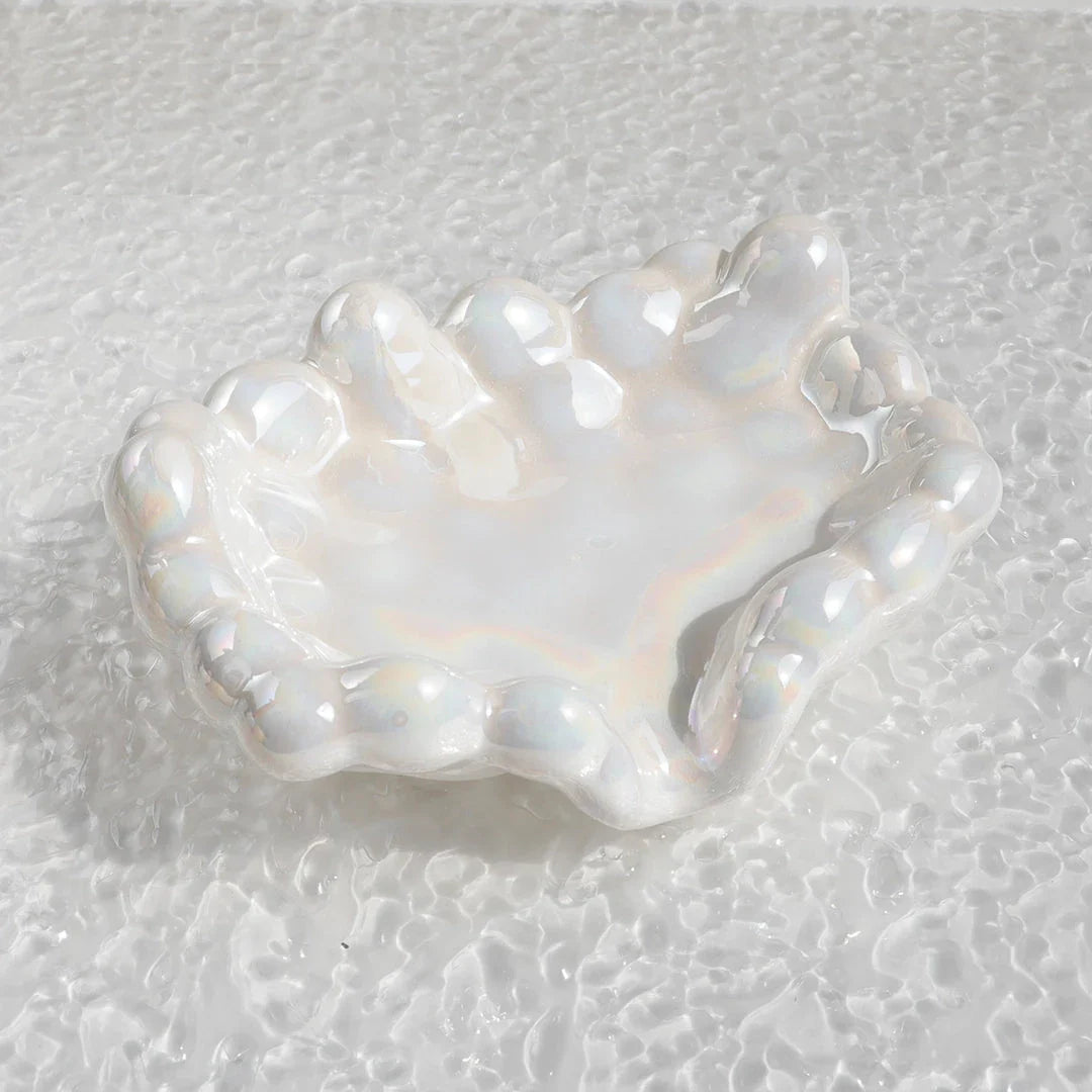 Ceramic soap dish with a whimsical cloud design, perfect for enhancing bathroom decor