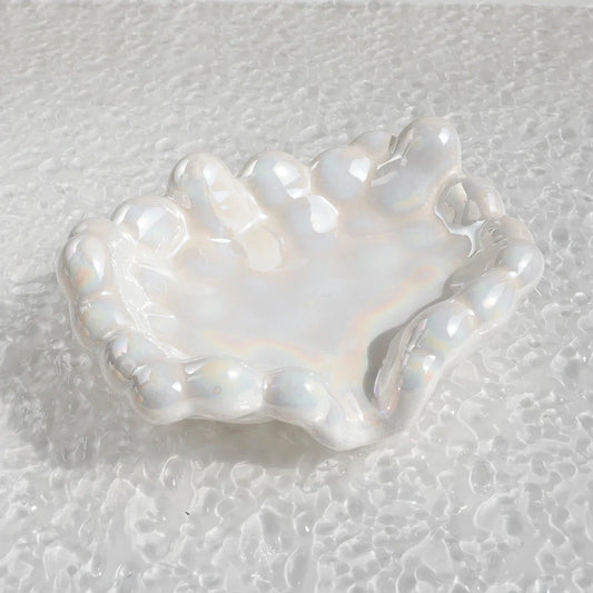 Ceramic soap dish with a whimsical cloud design, perfect for enhancing bathroom decor