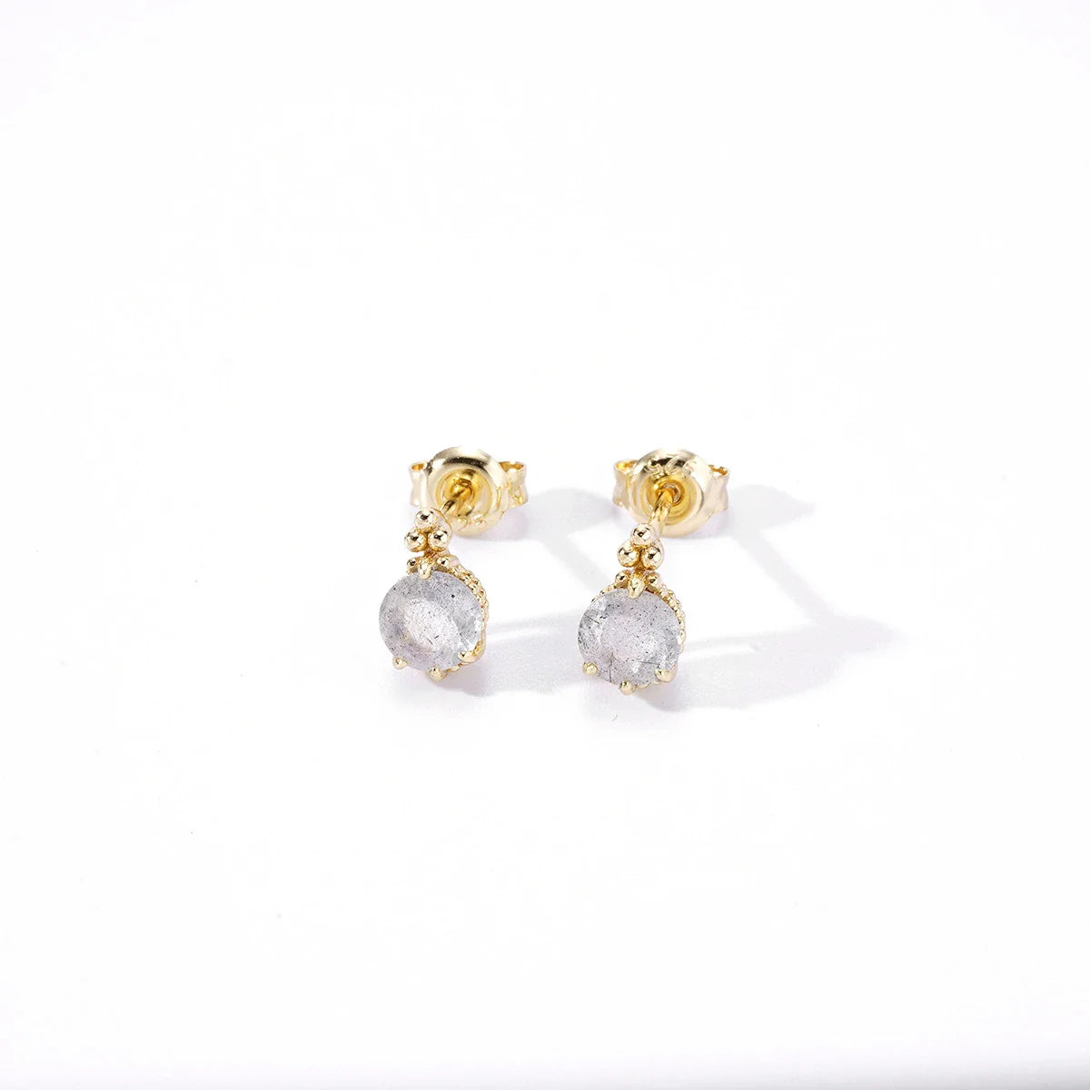 Pair of natural elongated stone earrings with a geometric design, crafted from silver and white crystal