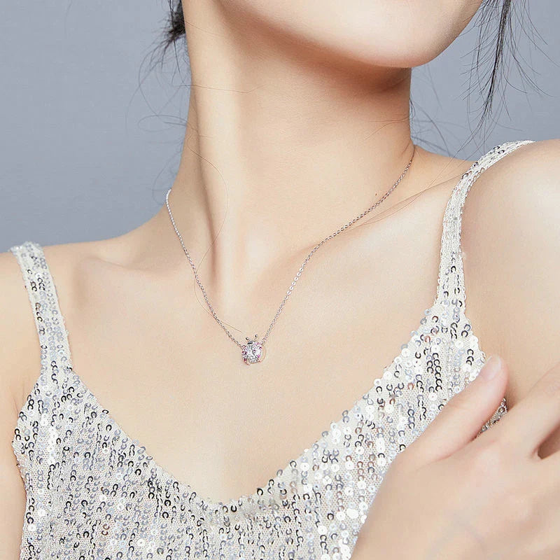 A sterling silver necklace featuring a charming ladybug design, with an adjustable chain for a customized fit.