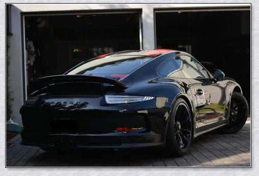 A bottle of Supergloss Car Coating Spray, showcasing its ability to protect and enhance the shine of a vehicle's paint, wheels, and other surfaces.