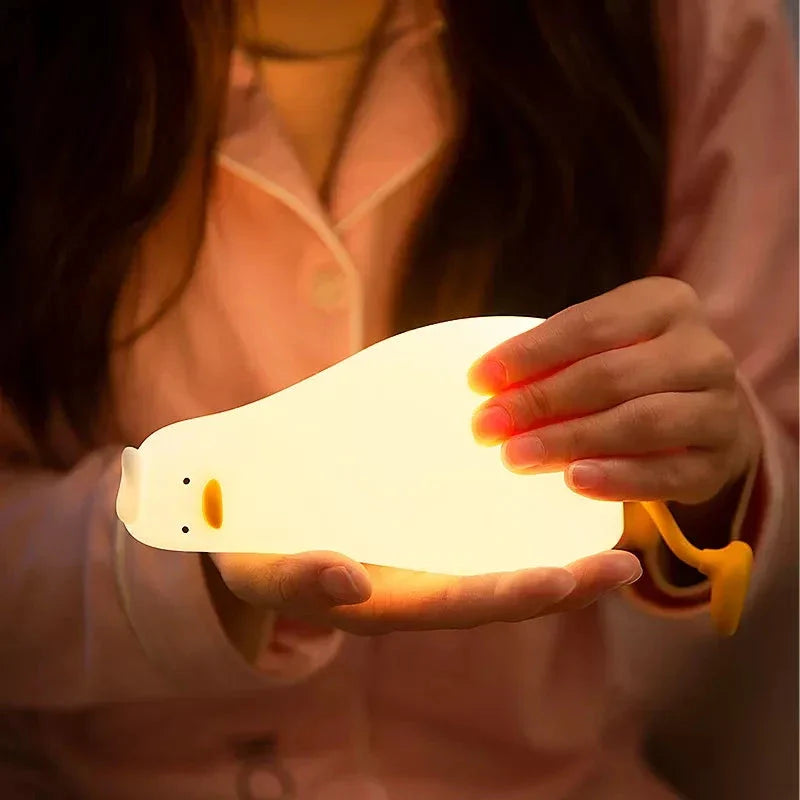 Cute duck-shaped LED night light with soft, warm illumination and touch-controlled brightness