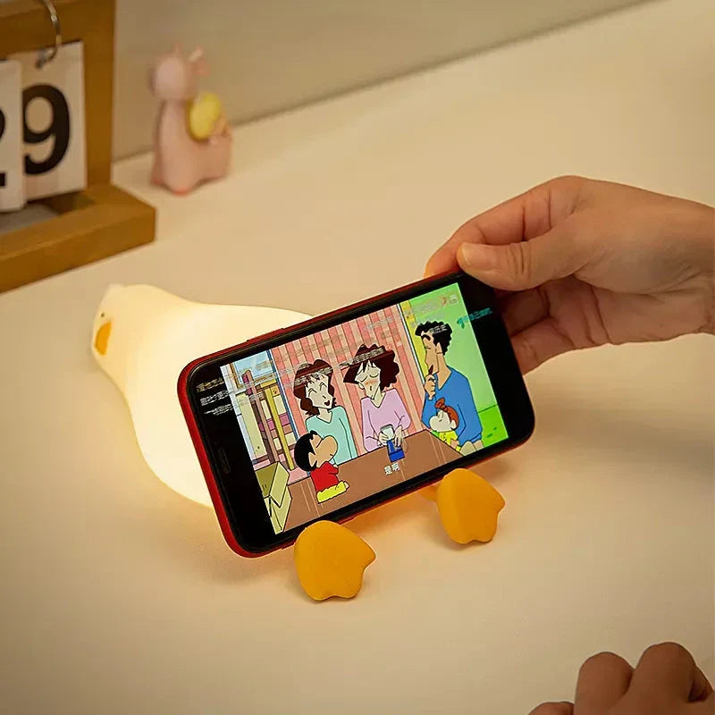 Cute duck-shaped LED night light with soft, warm illumination and touch-controlled brightness