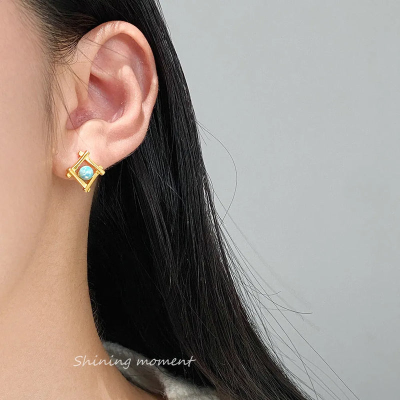 Geometric cross quadrangle stud earrings for women made from S925 silver available in silver or gold plating with a minimalist geometric shape suitable for everyday wear or special occasions